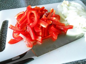Chicken stir fry: Cut the pepper and onion kipkitchen.com #chicken #StirFry #recipe #dinner #healthy