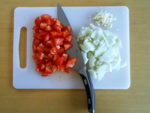 Cut Onion, Tomatoes and Garlic kipkitchen.com #shrimps #StirFry #HotSauce #recipe #dinner