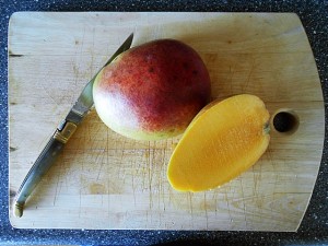 Easy Muffin Recipe with Mango-Cut the mango | kipkitchen.com #muffin #mango #recipe
